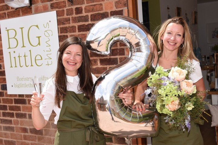 County firm celebrates two years of success in shop by teaming up with the National Trust