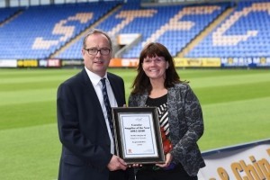 Kirsty Smallman receives the Support to Caradoc award from business manager Peter Masters.