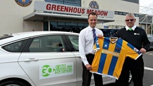 Shrewsbury Town’s Richard Hill with Steve Hughes, of Go Carz, at the Greenhous Meadow.