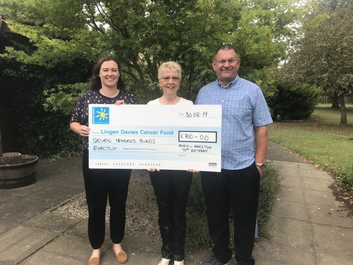 Oswestry couple hand over birthday donations to Lingen Davies to say thank you for treatment